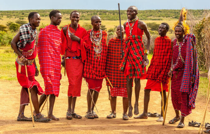 Maasai Village Cultural Experience in Tanzania Maasai people wearing traditional clothing during a cultural village experience near Mount Kilimanjaro, Tanzania